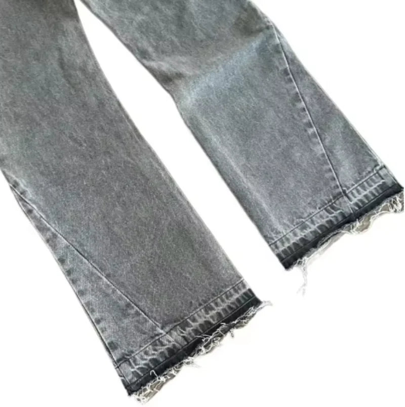 Gray jeans with lace trim on a white background