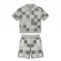 Gray checkered shirt and shorts set on a white background