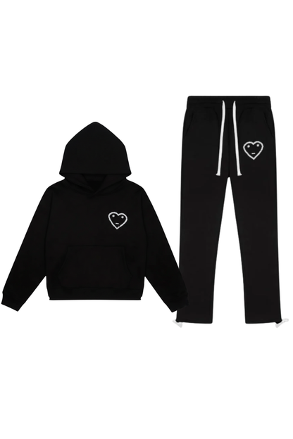 Black hoodie and pants set with heart designs on a white background
