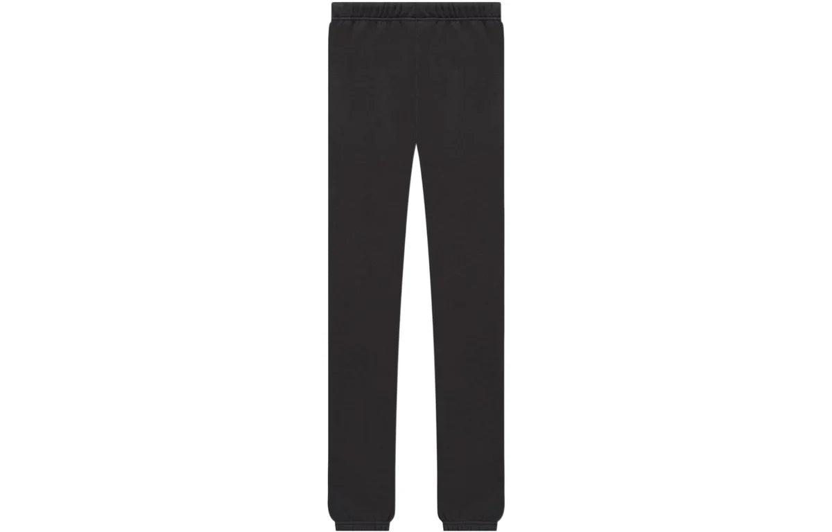 Back of Black essentials sweatpants with '1977' printed on the front against a white background