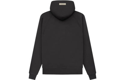 Back of black essentials hoodie with '1977' printed on the front against a white background