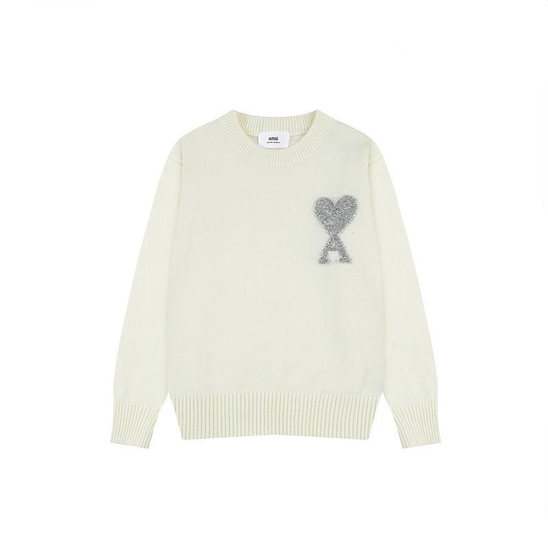 White AMI sweater with a decorative heart design on a white background