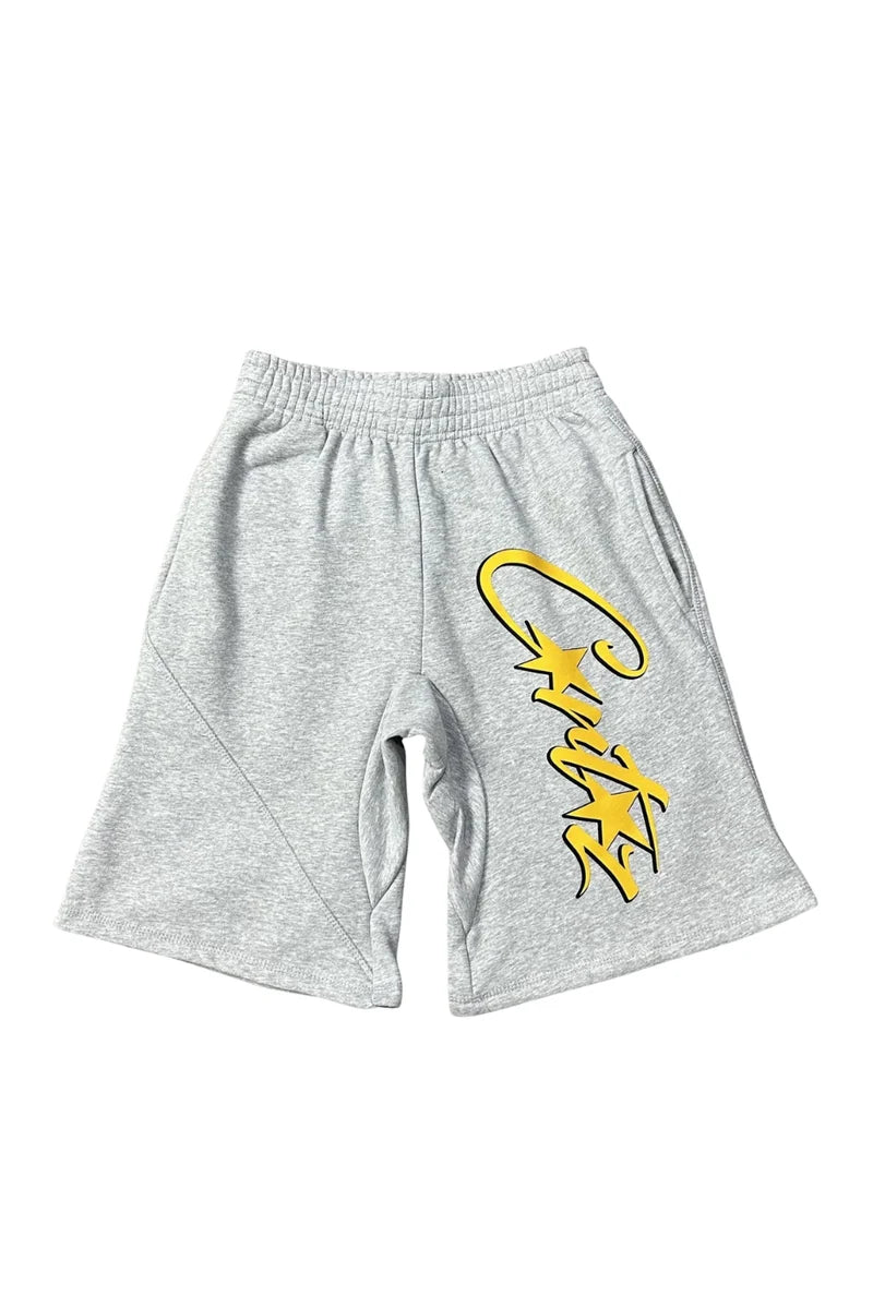 Gray shorts with yellow logo on a white background