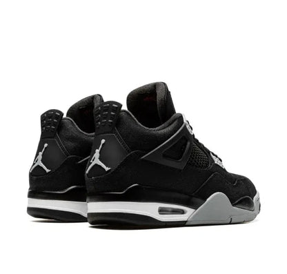 Air Jordan 4 Black and white sneakers with a prominent brand logo on a white background