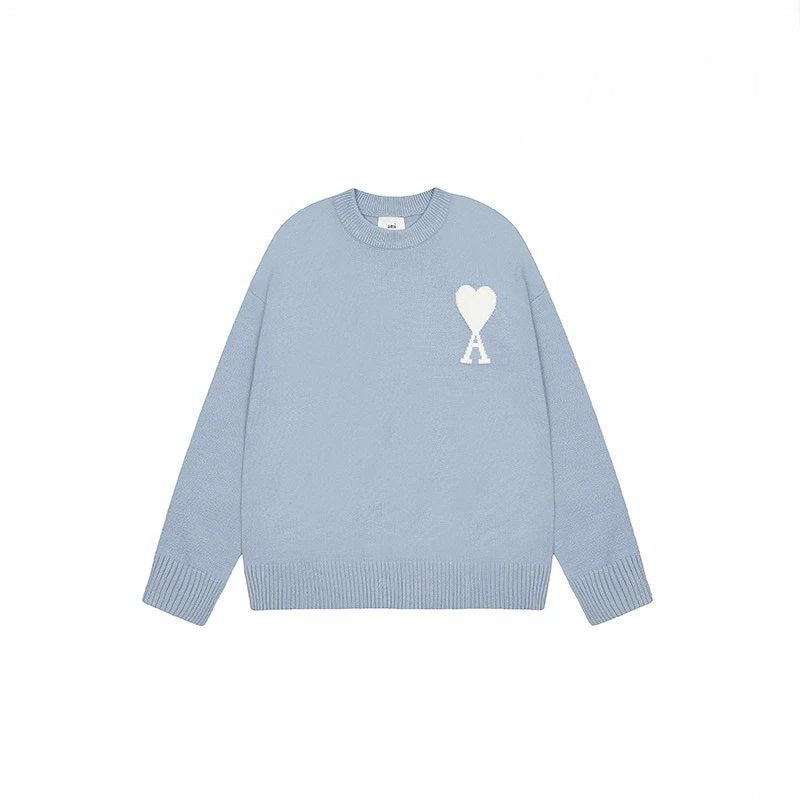 Light blue AMI sweater with a white logo on a white background