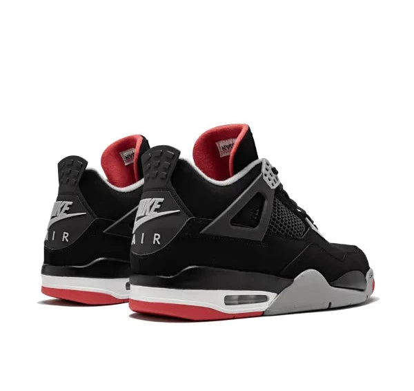 Air Jordan 4 Black Nike Air Jordan sneakers with red accents on a white background