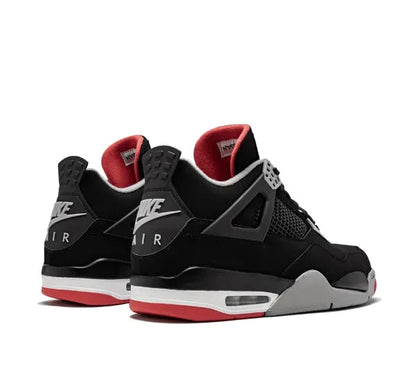 Air Jordan 4 Black Nike Air Jordan sneakers with red accents on a white background
