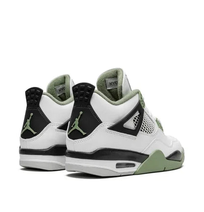 Pair of air Jordan 4 white sneakers with black and green accents on a white background