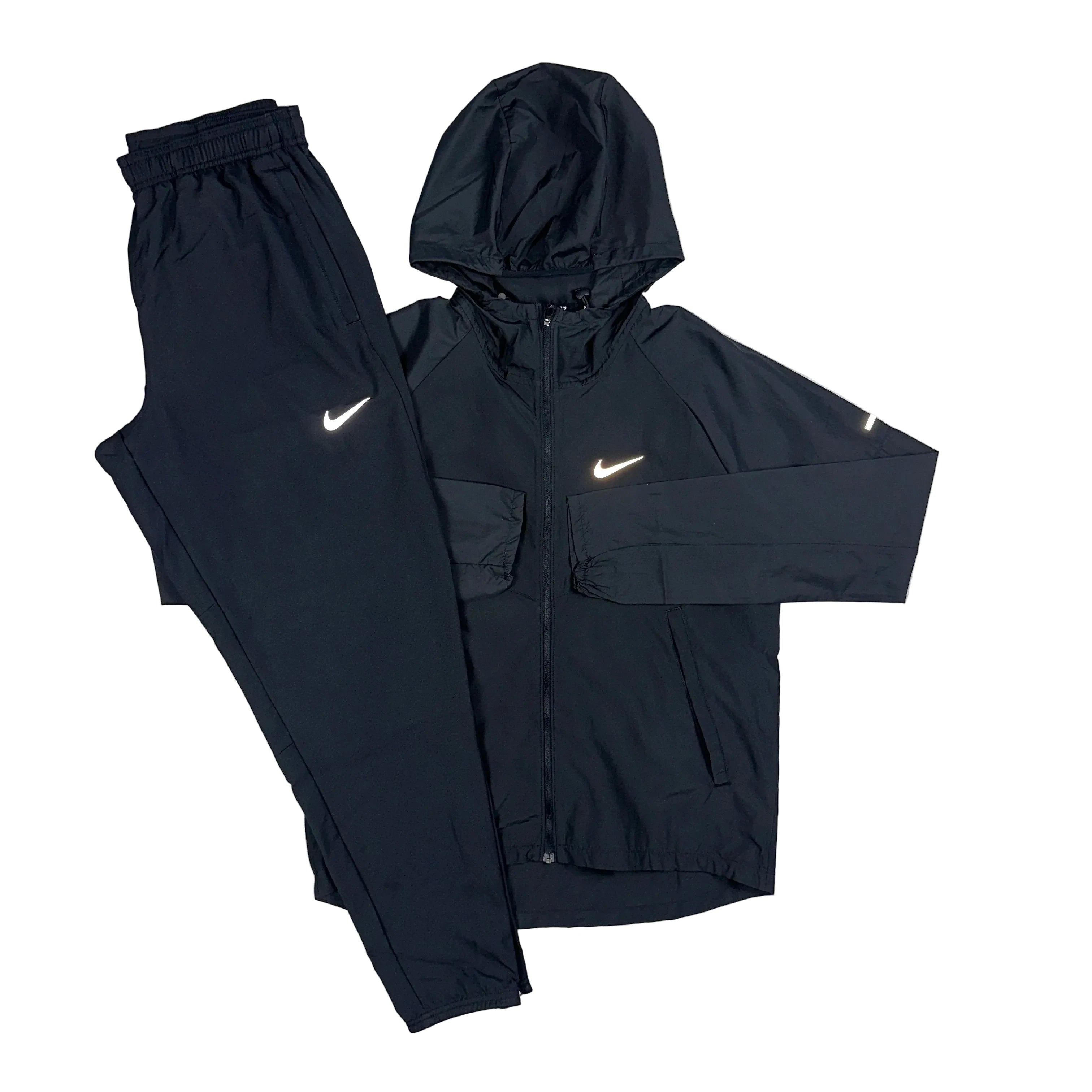 Black Nike miller repel tracksuit with reflective Nike logo on a white background