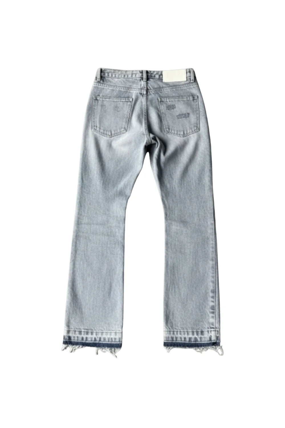 Light blue jeans with frayed hems on a white background
